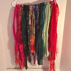 Vibrant sari silk fabric strands in various hues.Junk journal sewing or crafts.